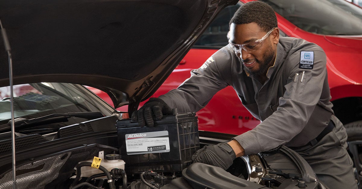 Service technician installing battery