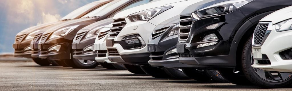 Row of SUVs in a dealership lot.