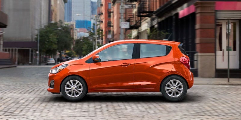 2021 red chevy spark side view