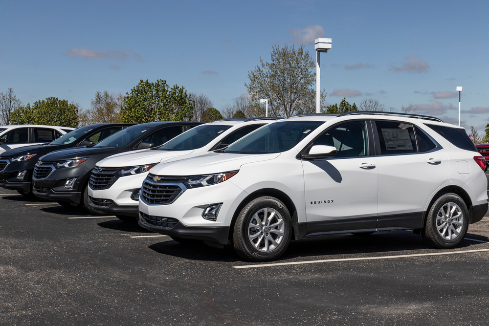 White Equinoxs parked side angle view