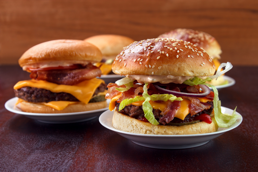 3 different types of hamburgers on plates