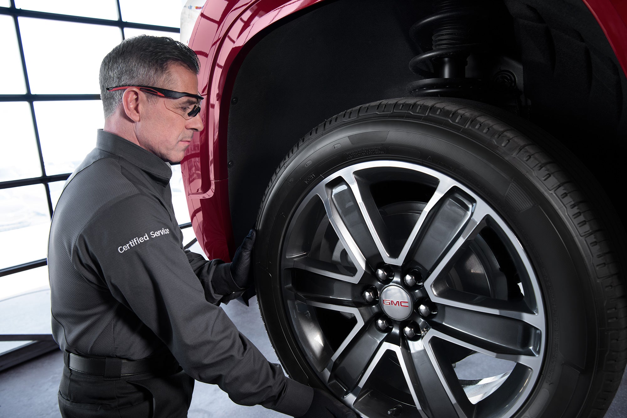 GMC service tech rotating tires