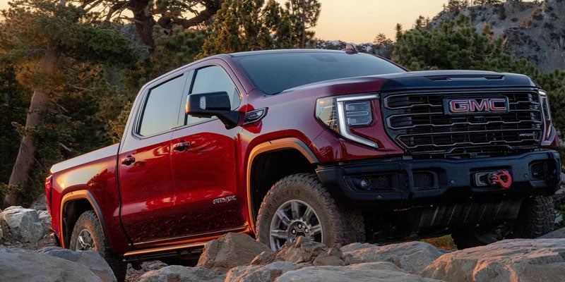 New Red 2026 GMC Sierra 1500 showing its off-road capabilities