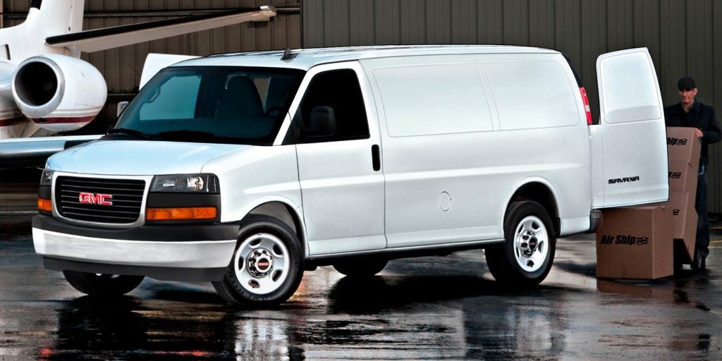 White 2026 GMC Savana Cargo Van in his front side profile