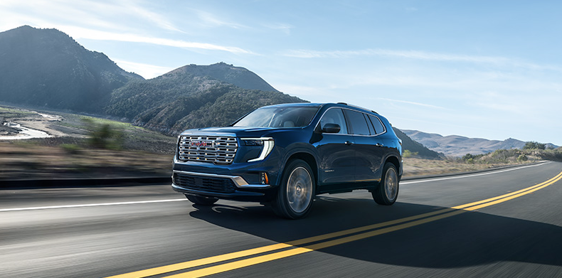 A 2026 GMC Terrain driving down the road.