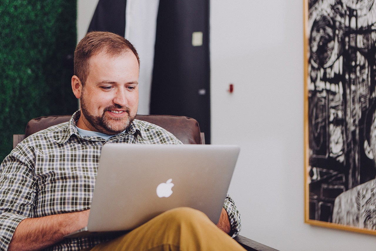 Man applying for Chevy financing on a laptop