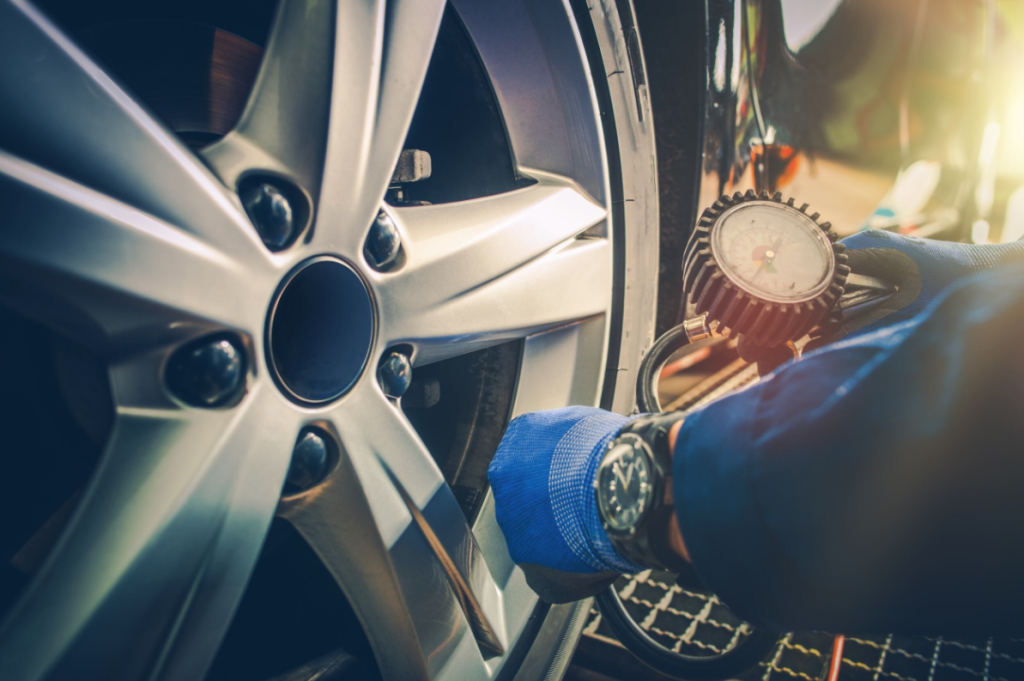 Car tire being refiled by technician