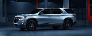 Silver 2021 Chevrolet Traverse parked in a garage.