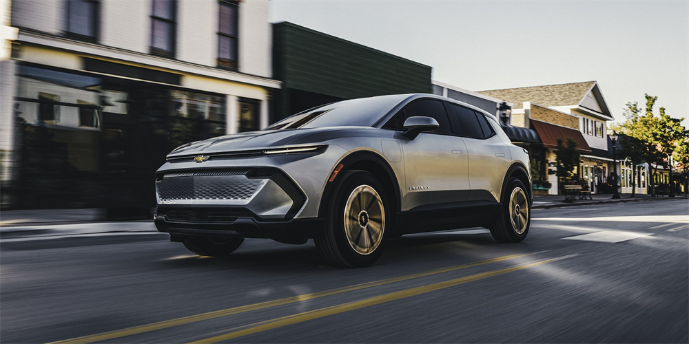 Silver 2026 Chevrolet Equinox EV on the road.