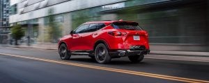 Red 2022 Chevy Blazer zooming on a road.