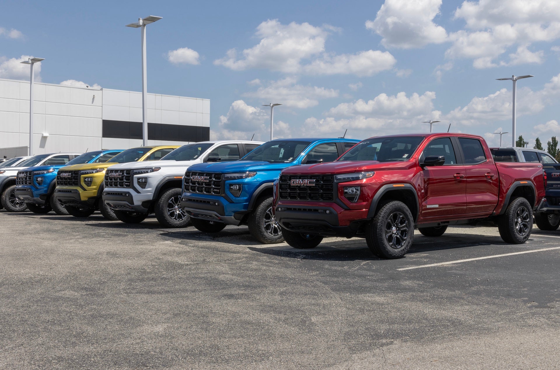 GMC Canyon Mid-Size pickup display at a dealership. GMC offers the Canyon in Elevation, AT4, Denali, and AT4X models.