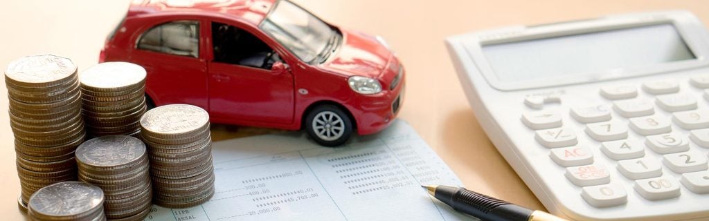 Car finance calculator with coins and vehicle model
