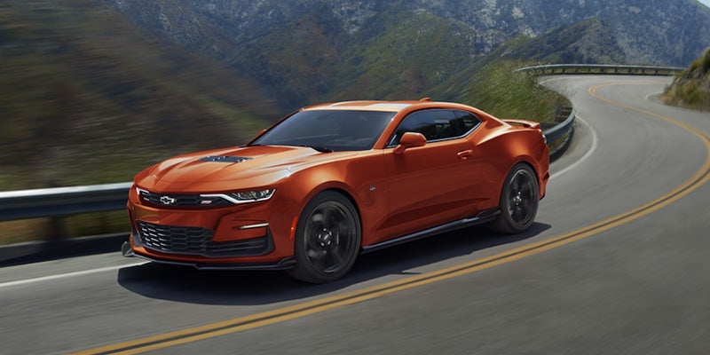 Orange Camaro Driving through Valley