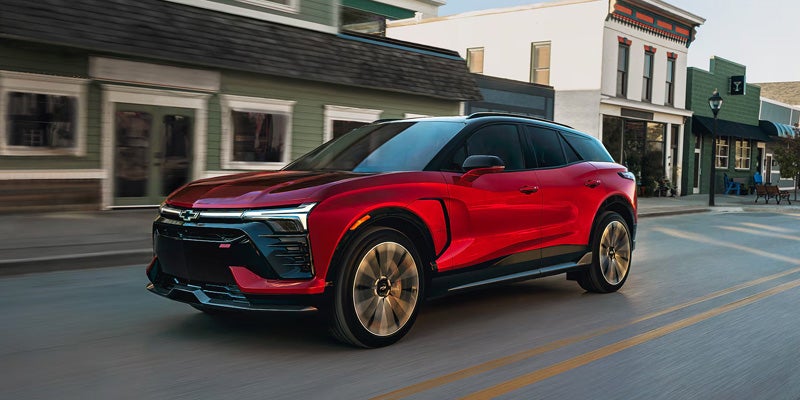 Red 2026 Chevrolet Blazer EV in front of a green house in Nitro, WV