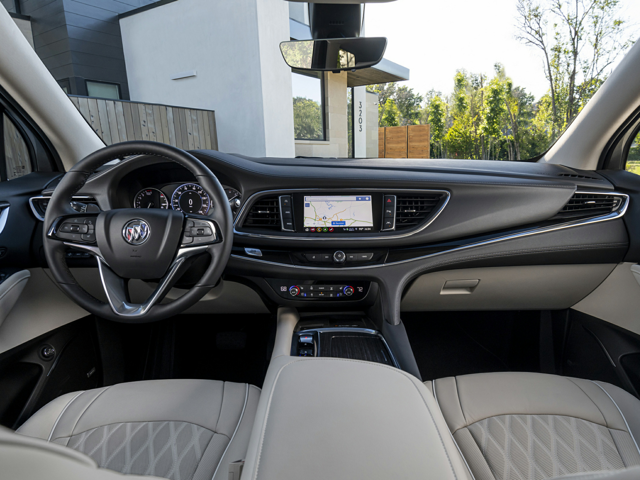The passenger and driver's seat of a Buick vehicle