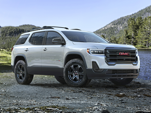 A white GMC Acadia outdoors