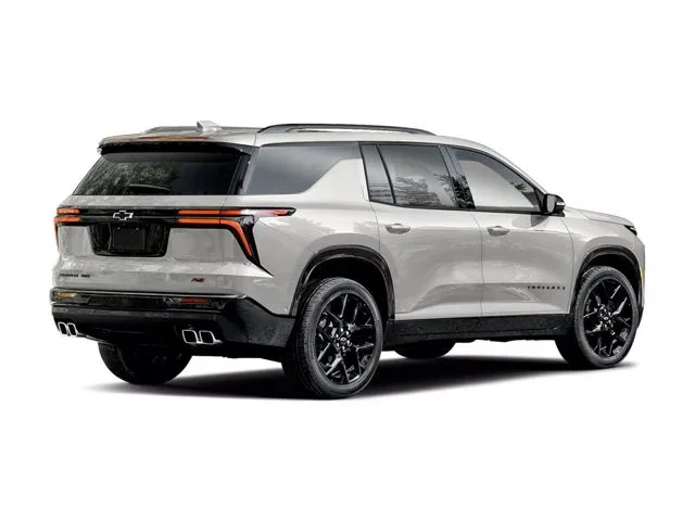 A silver Chevrolet Traverse in a white background