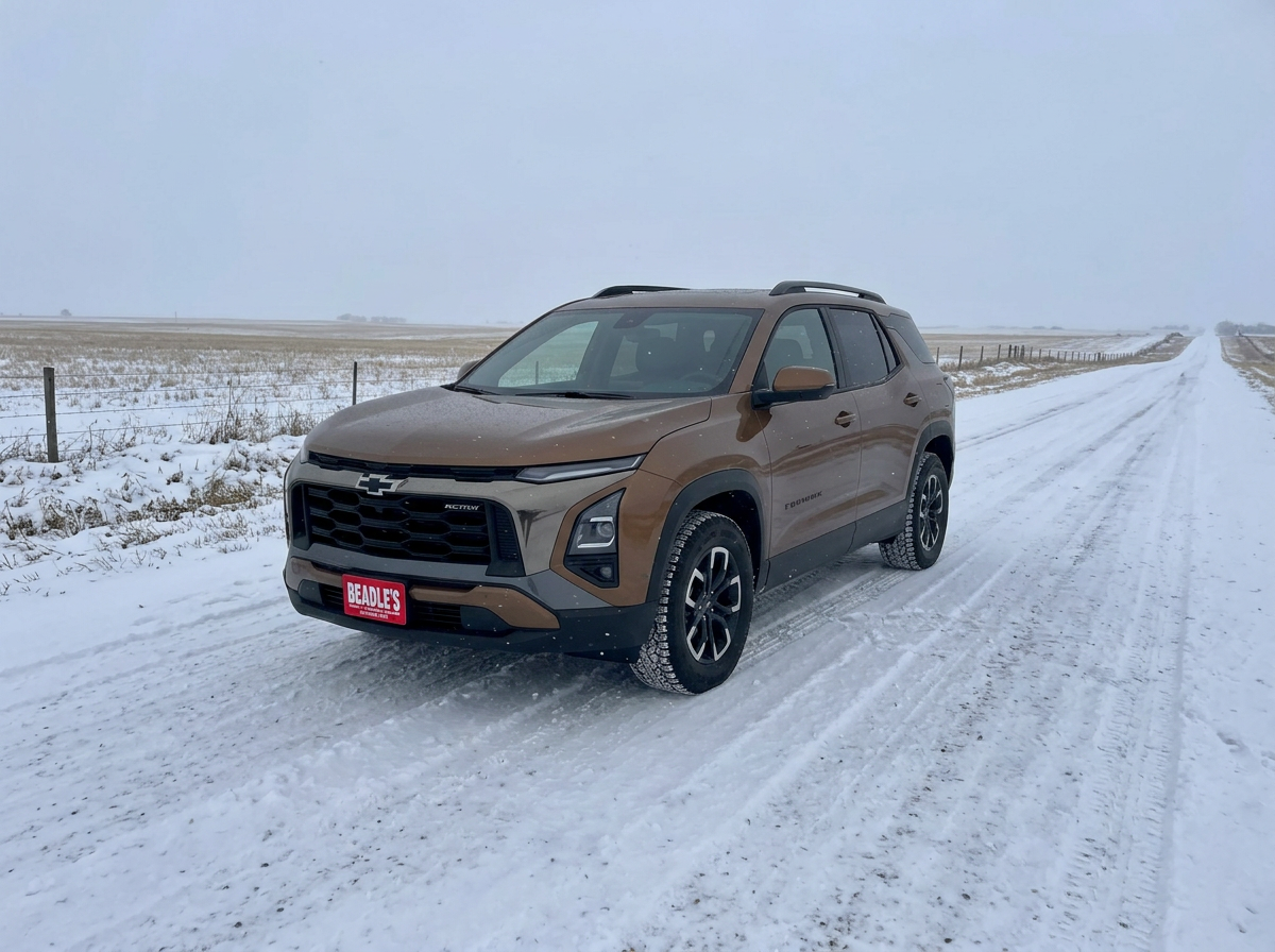2027 Chevrolet Equinox AWD on a snow-packed gravel road under an overcast winter sky near Mobridge, South Dakota