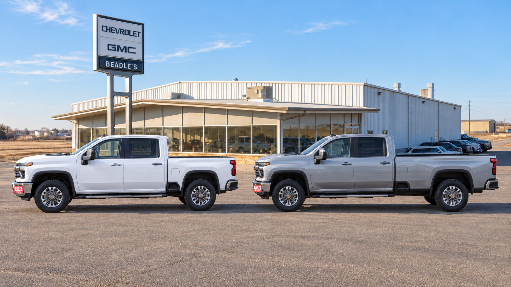 Two Chevrolet Silverado 2500 HD Crew Cabs side by side showing the standard bed against the eight-foot long box