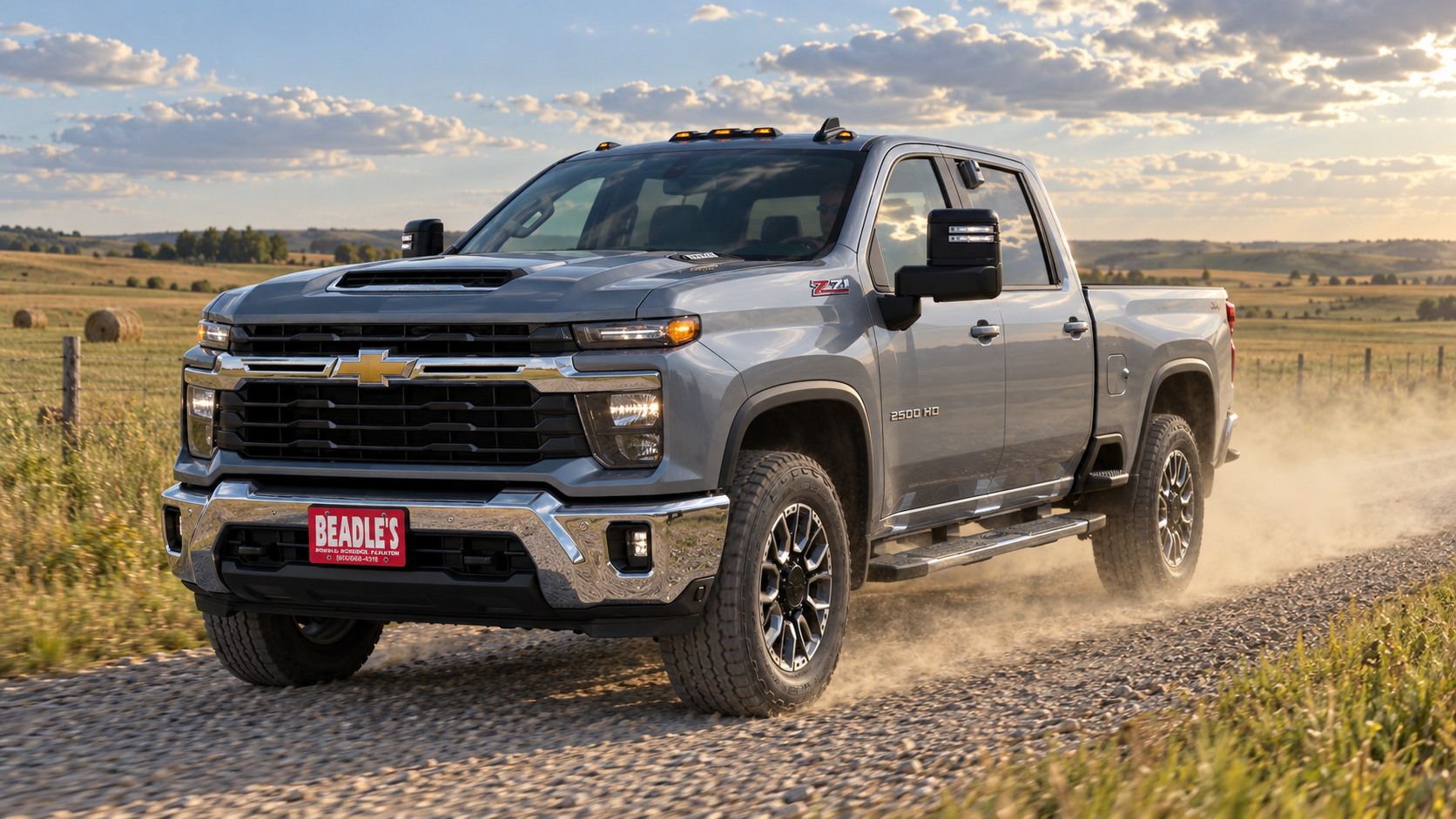 2026 Chevrolet Silverado 2500 HD LT in Sterling Gray Metallic with the Z71 fender badge on a gravel section-line road near Mobridge, South Dakota