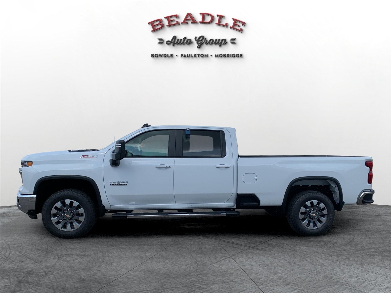 Profile of the Chevrolet Silverado 3500 HD LT long bed single rear wheel truck on the lot at Beadle Chevrolet GMC