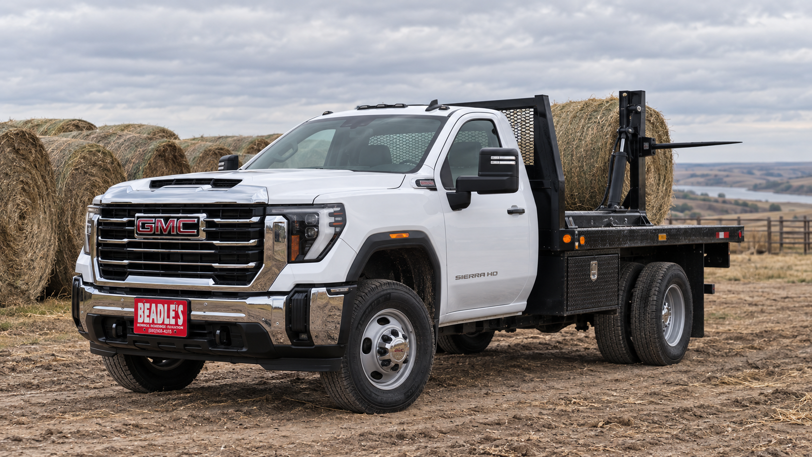 GMC Sierra 3500 HD Pro chassis cab with a bale bed in a hay yard near Mobridge, South Dakota