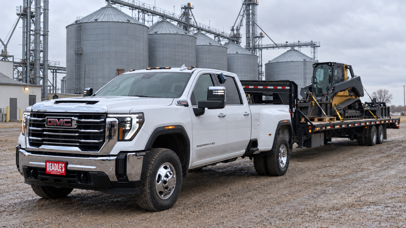 2026 GMC Sierra 3500 HD SLE dually backing a hotshot deck to a grain elevator near Mobridge, South Dakota