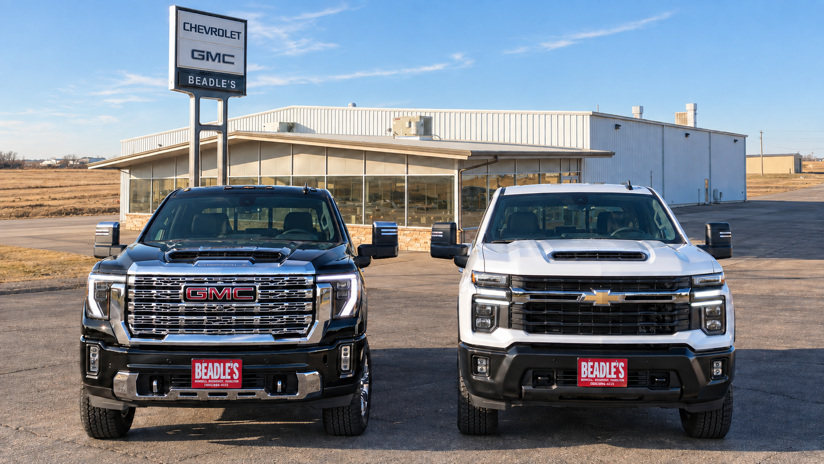 2026 GMC Sierra 2500 HD and Chevrolet Silverado 2500 HD side by side at Beadle Chevrolet GMC in Mobridge