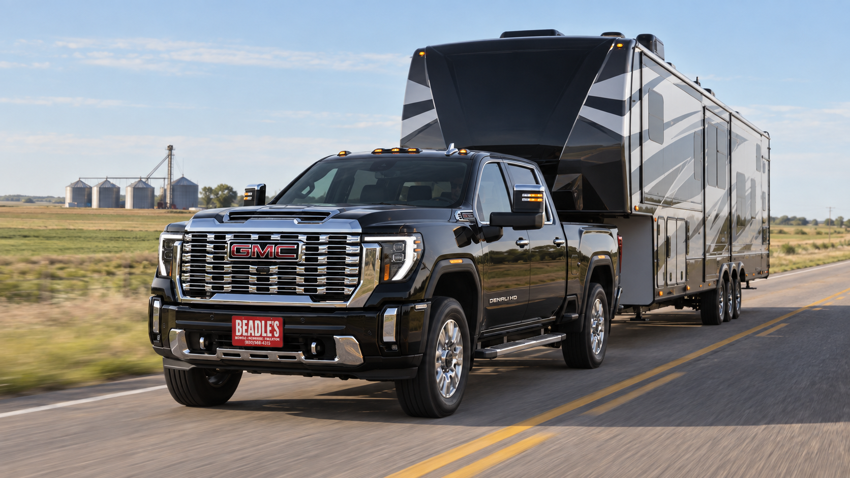 2026 GMC Sierra 2500 HD Denali towing a fifth-wheel toy hauler on US Highway 12 near Mobridge, South Dakota