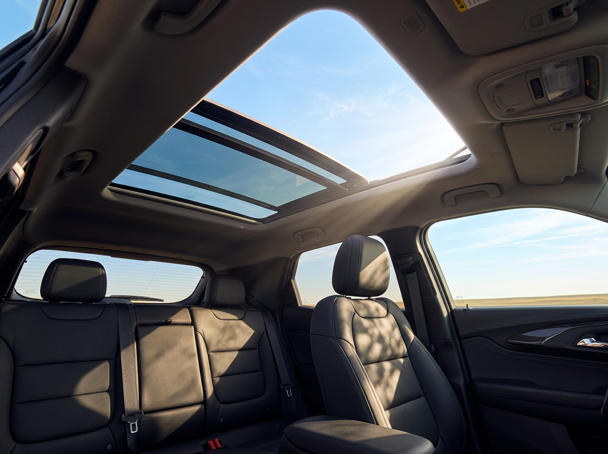 Dual-pane panoramic sunroof open to a blue prairie sky in the 2026 Chevrolet Trailblazer