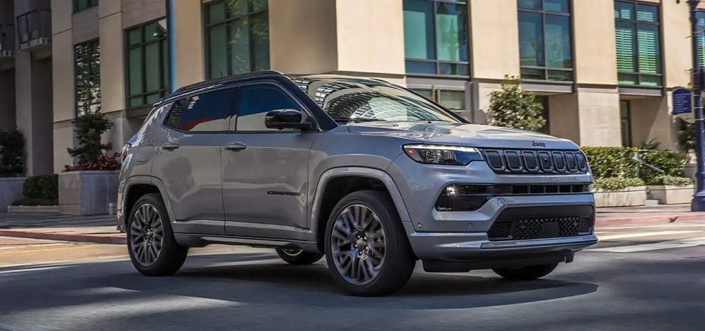 A silver 2022 Jeep Compass parked on a street.