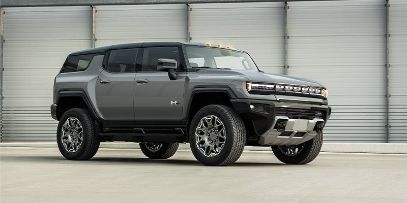 Side profile of a 2024 GMC Hummer EV SUV. 