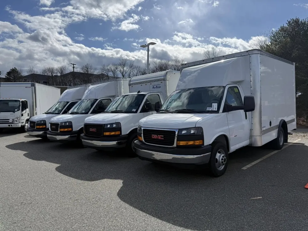 Lineup of GMC Savana commercial box trucks at Marty’s GMC in Kingston