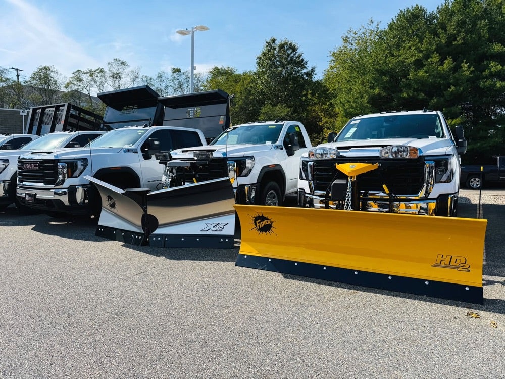 GMC trucks equipped with FISHER snowplows