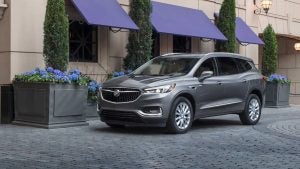 Grey 2021 Buick Enclave parked outside of store.