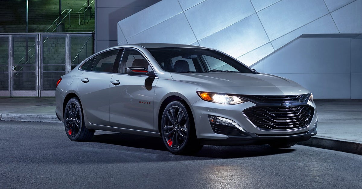 2024 Chevrolet Malibu Parked in Front of a Building