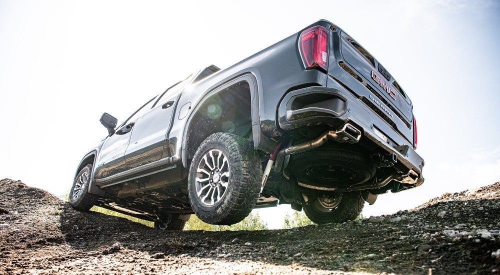 A black 2025 GMC Sierra 1500 from the rear at an angle.