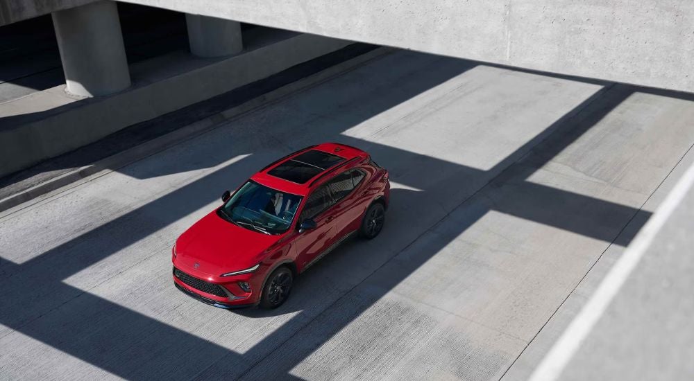 A red 2026 Buick Envision shown in a parking garage.
