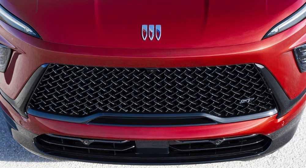 Front grille of a red 2026 Buick Enclave ST.