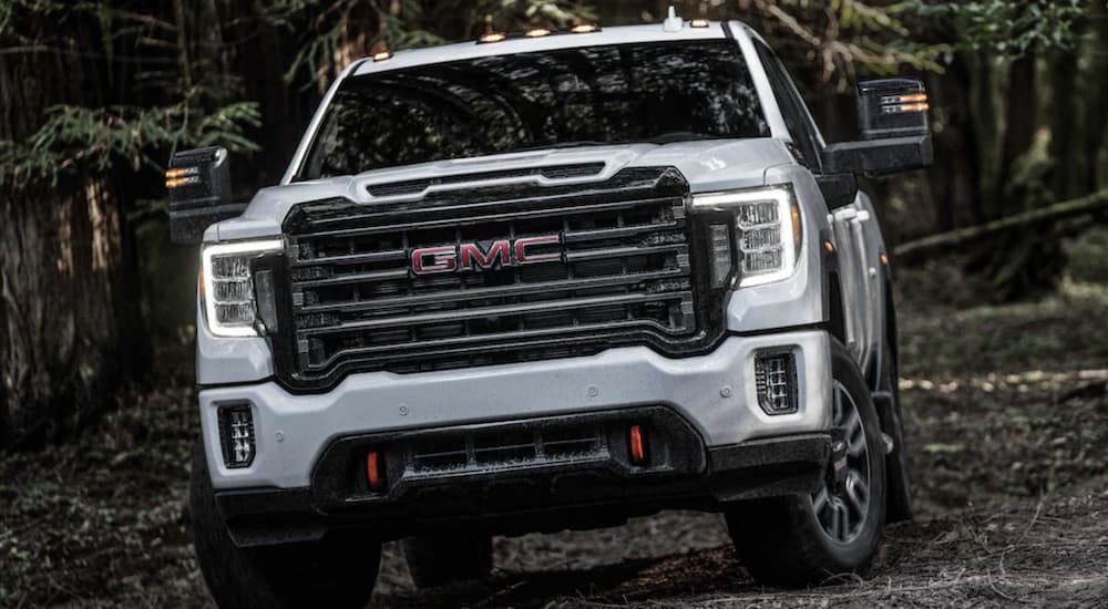 A white 2023 GMC Sierra 2500 HD AT4 from a dealer with used trucks for sale