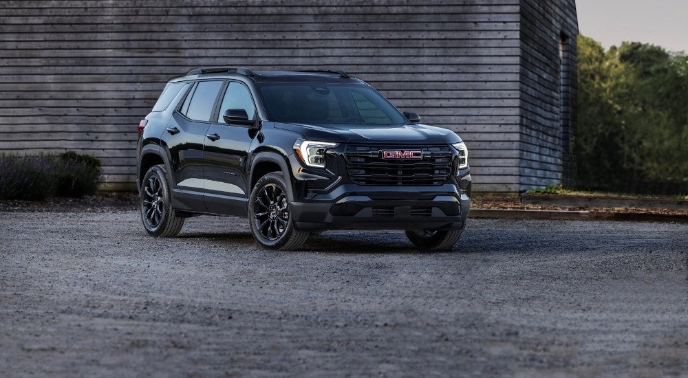 A black 2025 GMC Terrain is shown from the front at an angle after leaving a GMC dealer.