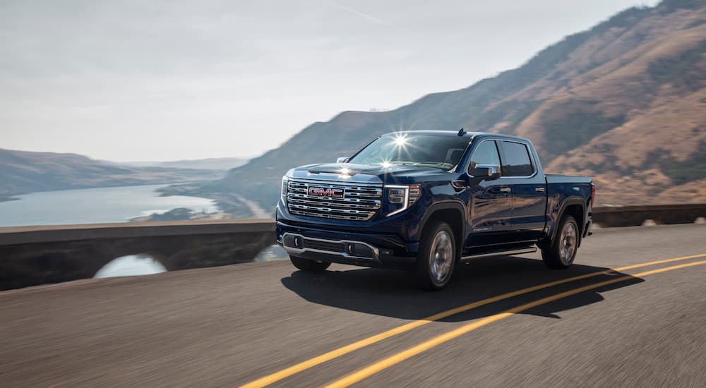 A black 2025 GMC Sierra 1500 Denali is shown from the front at an angle.