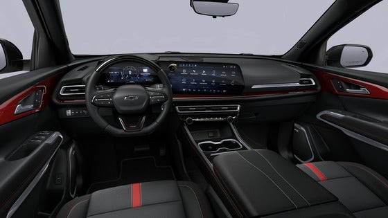 The refined interior of the 2024 Chevrolet Traverse, showcasing the new 17.7-inch diagonal infotainment touchscreen, sleek dashboard design, and spacious seating for up to eight passengers