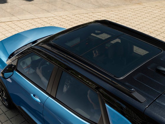 2025 Chevy Trailblazer Panoramic Sunroof The available panoramic sunroof on the 2025 Chevrolet Trailblazer, open to a bright blue sky, filling the interior with natural light