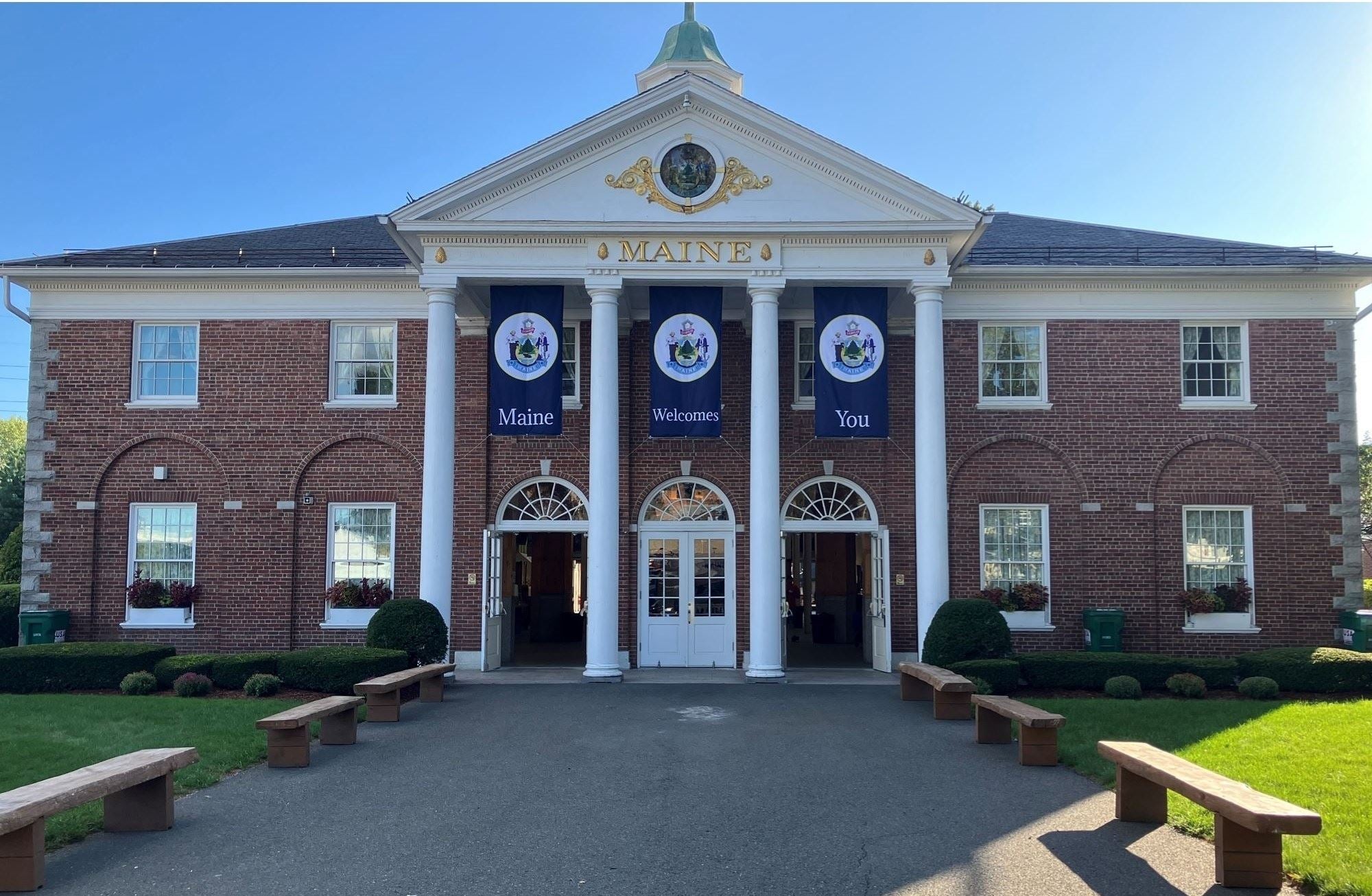 A photo of the Maine Building at The Big E, showcasing its distinctive architecture and perhaps some festive decorations for Maine Day