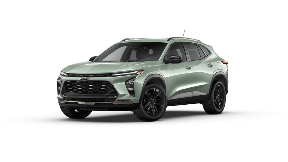 A bold 2025 Chevrolet Trax Activ in Cactus Green, navigating a scenic off-road trail, demonstrating its adventurous spirit and rugged capability