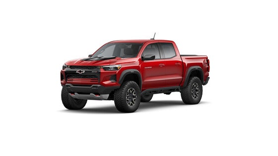 A 2024 Chevrolet Colorado ZR2 in Radiant Red, highlighting its aggressive off-road stance, raised suspension, and rugged design