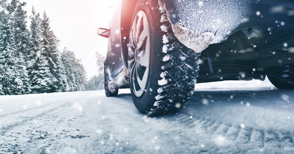 A vehicle driving on snowy terrain
