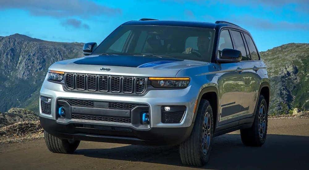 A silver 2022 Jeep Grand Cherokee 4xe is shown from the front at an angle.