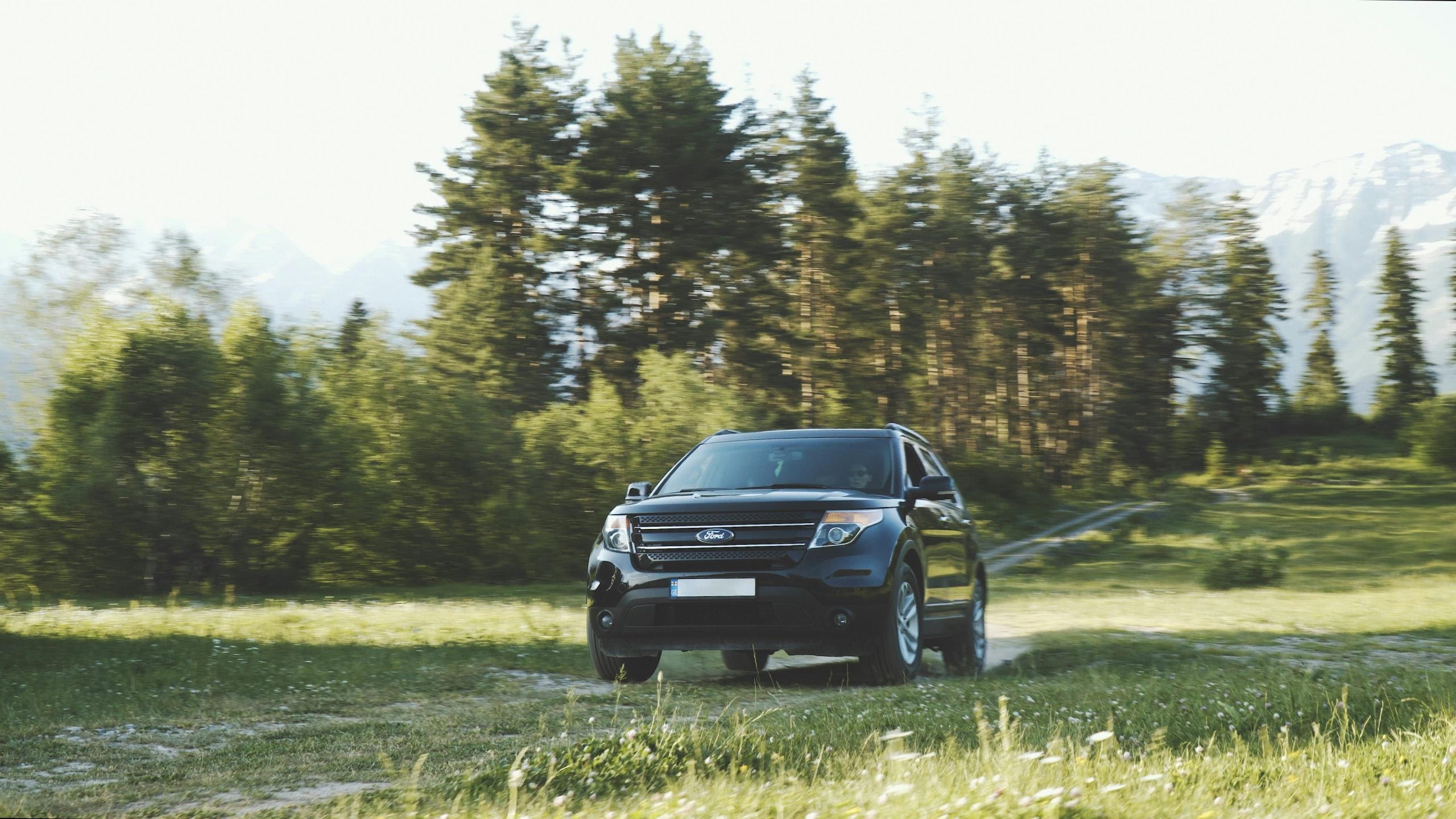 Photo of SUV on Dirt Road